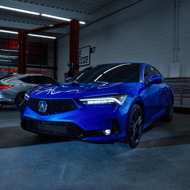 All-New 2023 Acura Integra at Bobby Rahal Acura | Blue 2023 Acura Integra Parked in Car Service Garage