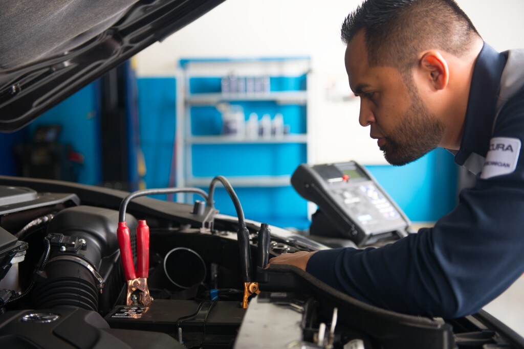 Bobby Rahal Acura is a Car Dealership near Dillsburg PA | Acura mechanic checking car battery