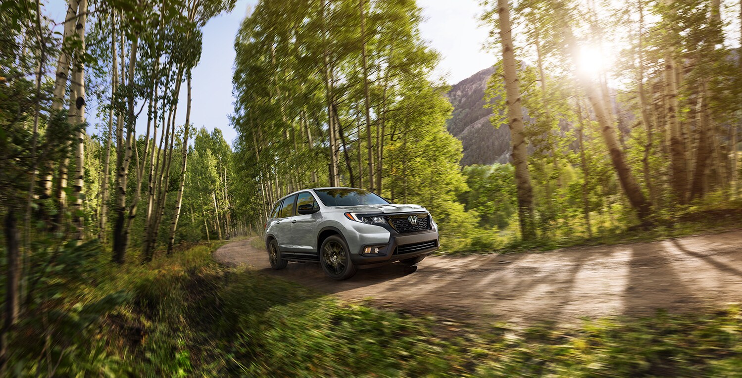 Bobby Rahal Honda is a Car Dealership near Carlisle PA | 2021 Honda Passport driving through dirt road
