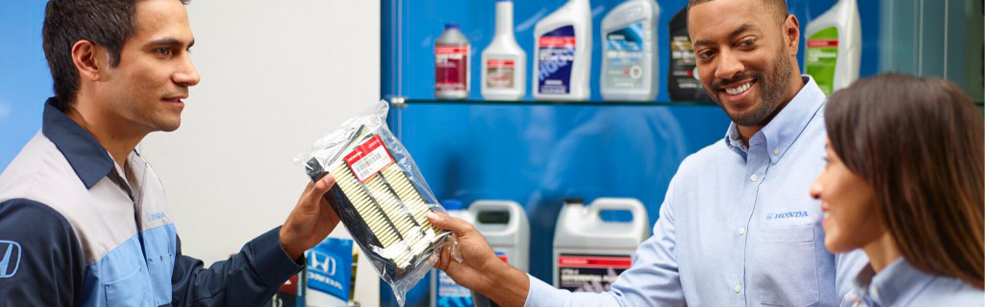 Bobby Rahal Honda is a Car Dealership near Lewisberry PA | Service Advisor Talking to Parts Advisors About Genuine Honda Air Filter