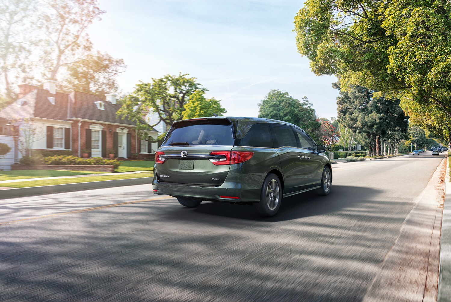 Bobby Rahal Honda is a Car Dealership near Carlisle PA | 2021 Honda Odyssey driving in neighborhood