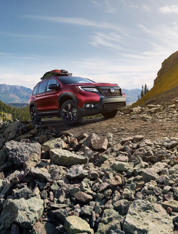 What you can get to personalize your vehicle at Bobby Rahal Honda in State College | Red Honda Passport driving up a cliff What you can get to personalize your vehicle at Bobby Rahal Honda in State College | Red Honda Passport driving up a cliff
