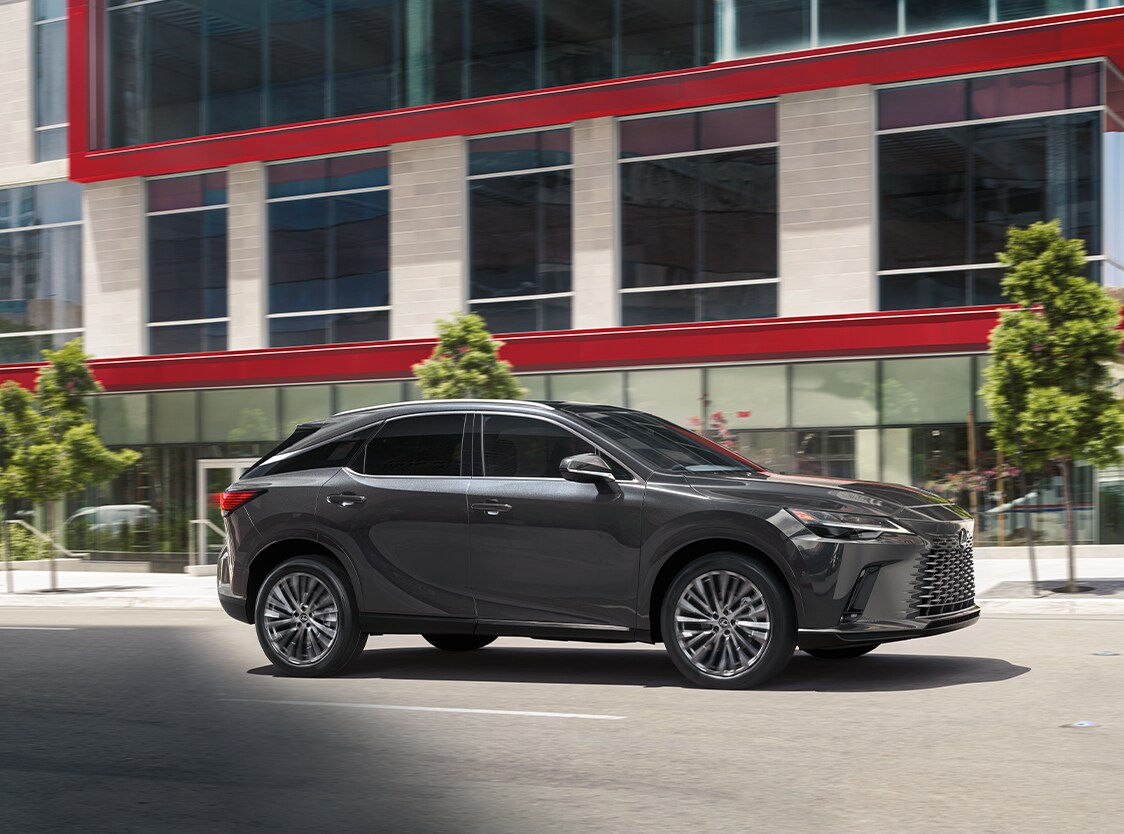 2023 Lexus RX at Bobby Rahal Lexus of Lancaster County in Ephrata, PA | Grey 2023 Lexus RX driving down a city road