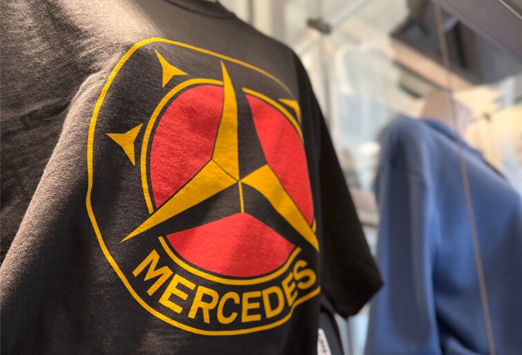 Mercedes-Benz vests and quarter zip with holiday gift boxes