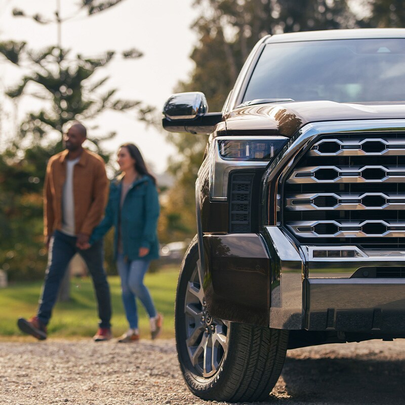 The All-New 2022 Toyota Tundra at Bobby Rahal Toyota in Mechanicsburg, PA | Couple Walking Next to 2022 Toyota Tundra
