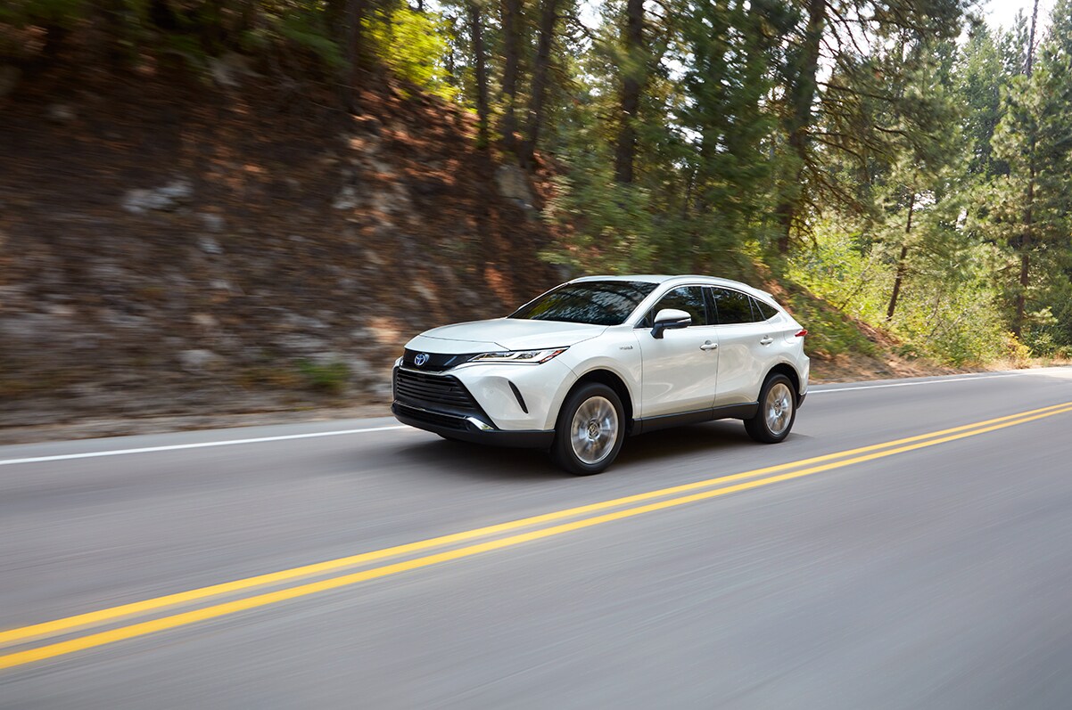 Bobby Rahal Toyota is a Car Dealership near New Cumberland PA | The 2021 Toyota Venza driving through a neighborhood