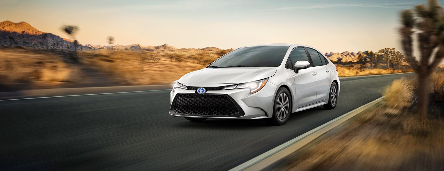 Toyota Hybrid for Everyone at Bobby Rahal Toyota | 2022 Toyota Corolla Hybrid driving down desert road