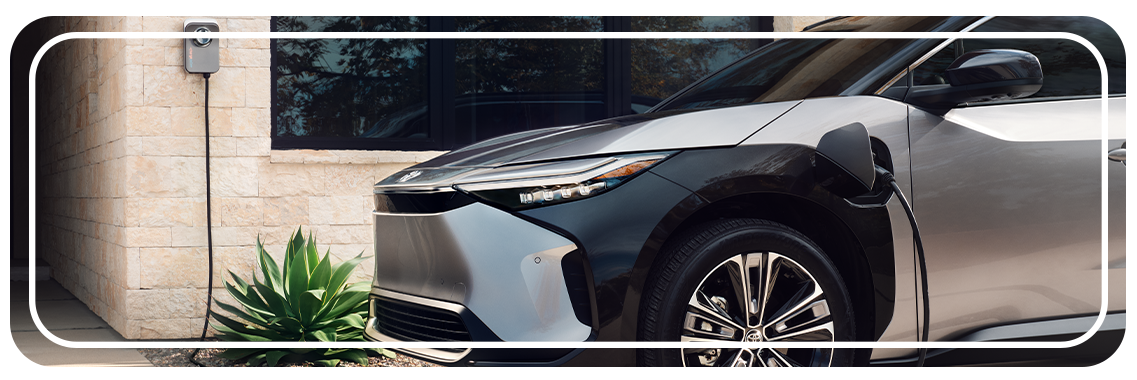How to prepare your home for your new Electric Vehicle at Bobby Rahal Toyota in Mechanicsburg, PA | Front profile of a 2023 Toyota bZ4X charging outside