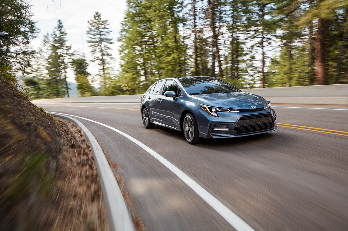 Bobby Rahal Toyota is a Car Dealership near New Cumberland PA | The 2021 Toyota Corollla driving through backroads