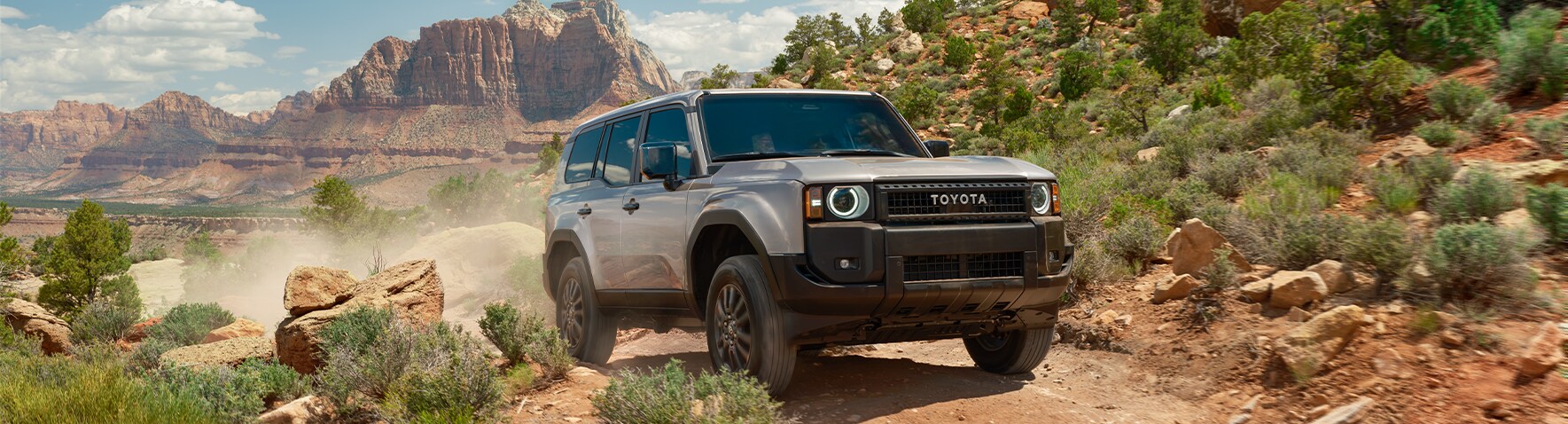 2024 Toyota Land Cruiser at Bobby Rahal Toyota in Mechanicsburg, PA | Front profile of a 2024 Toyota Land Cruiser in the color grey