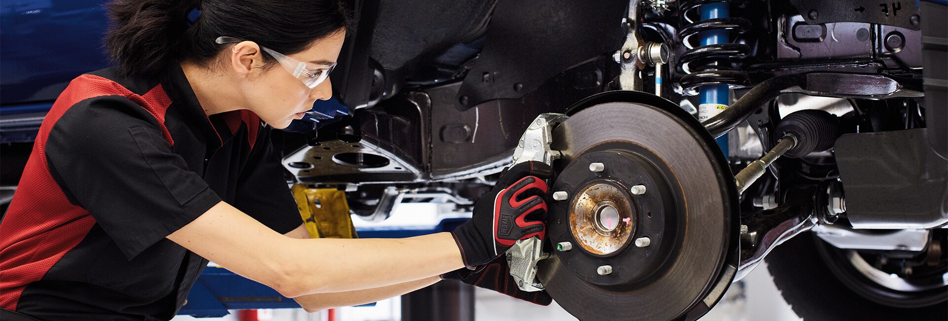 Bobby Rahal Toyota is a Car Dealership near Mechanicsburg, PA | Female Tire Technician Changing Tire