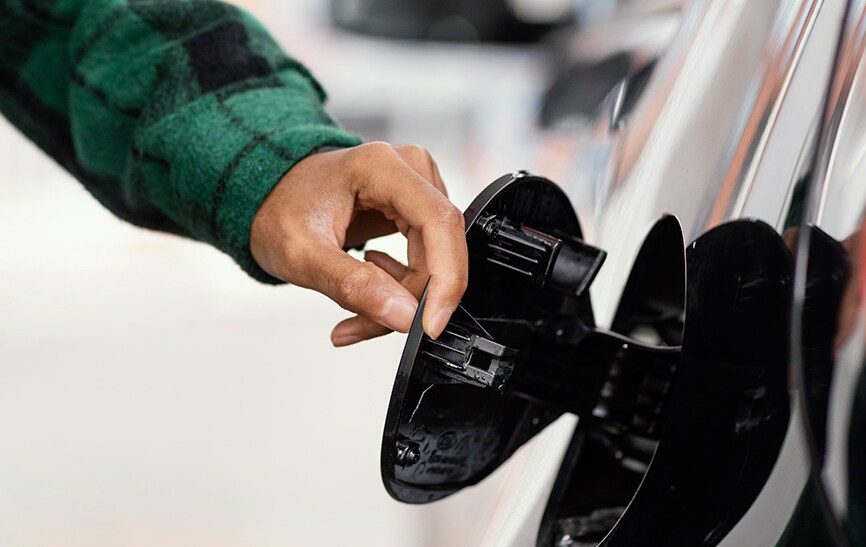 What Type of Gas is Best for My Car? | Bobby Rahal Toyota in Mechanicsburg, PA | Hand opening up gas tank cap