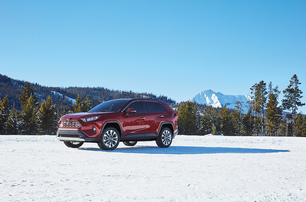 How to prepare your Toyota for the winter season in Mechanicsburg, PA at Bobby Rahal Toyota | 2021 Toyota RAV4 parked in the snow