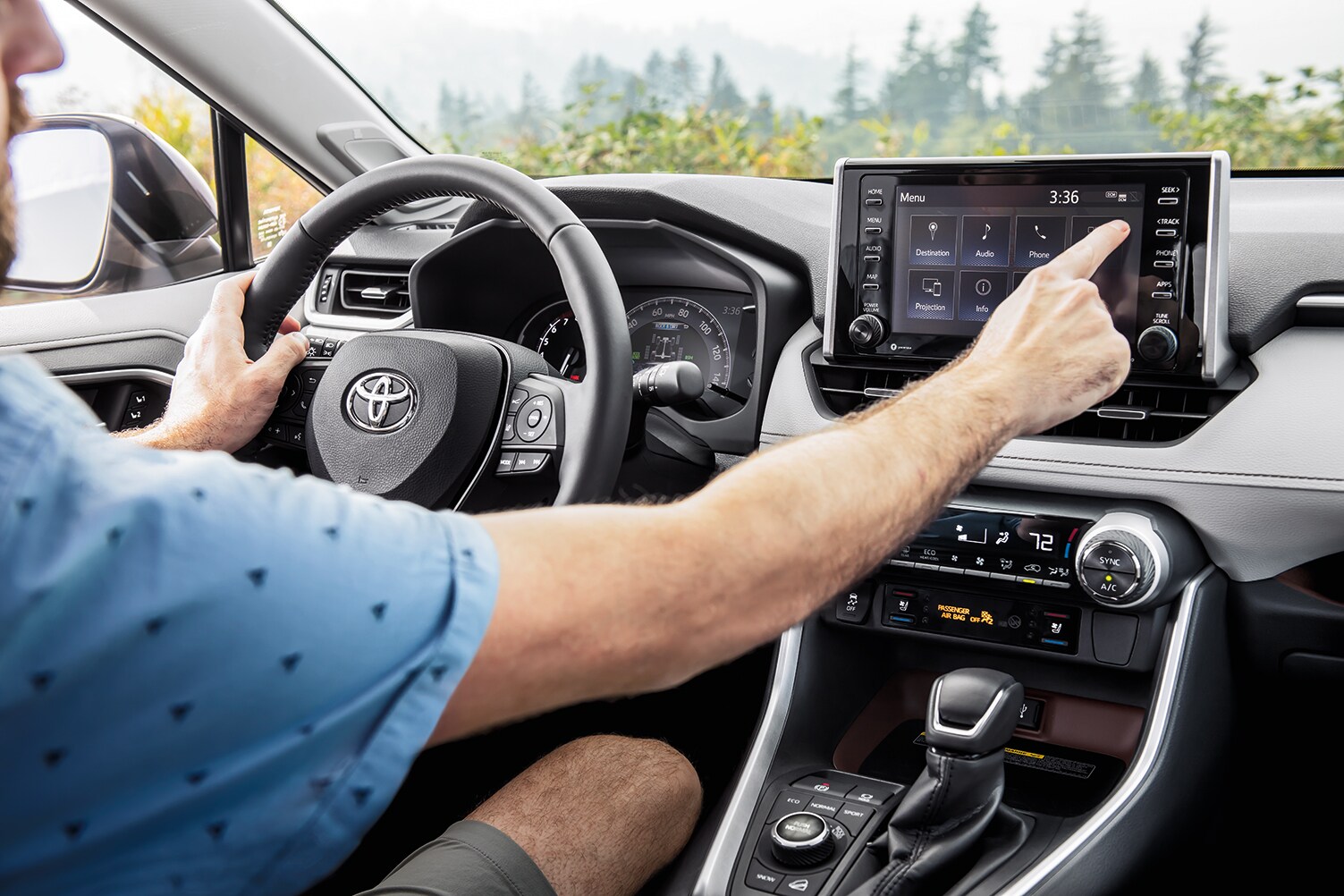 Bobby Rahal Toyota is a Car Dealership near Dillsburg PA | Interior view of man driving 2021 Toyota RAV4
