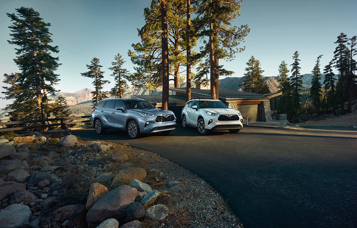 Bobby Rahal Toyota is a Car Dealership near Enola PA | Two 2021 Toyota Highlanders parked in the woods