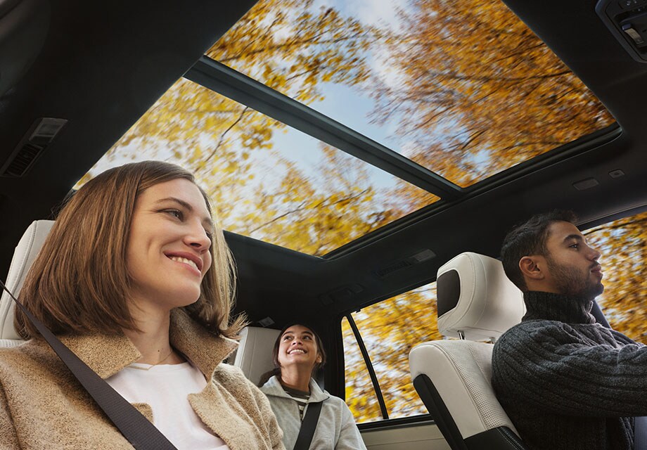 Model Features of the All-New 2023 Toyota Sequoia at Bobby Rahal Toyota | Interior Shot of Family Driving a 2023 Toyota Sequoia with the Sun Roof Open