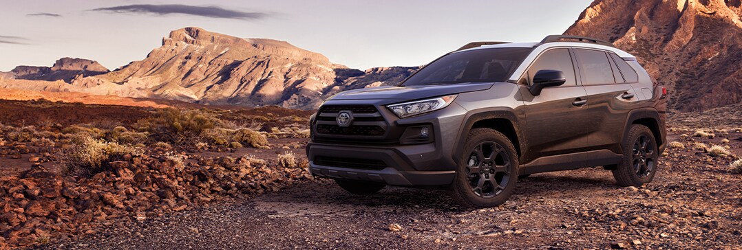 Compare the 2021 Toyota RAV4 vs. the 2021 Subaru Forester at Bobby Rahal Toyota of Mechanicsburg | RAV4 on rocky cliff