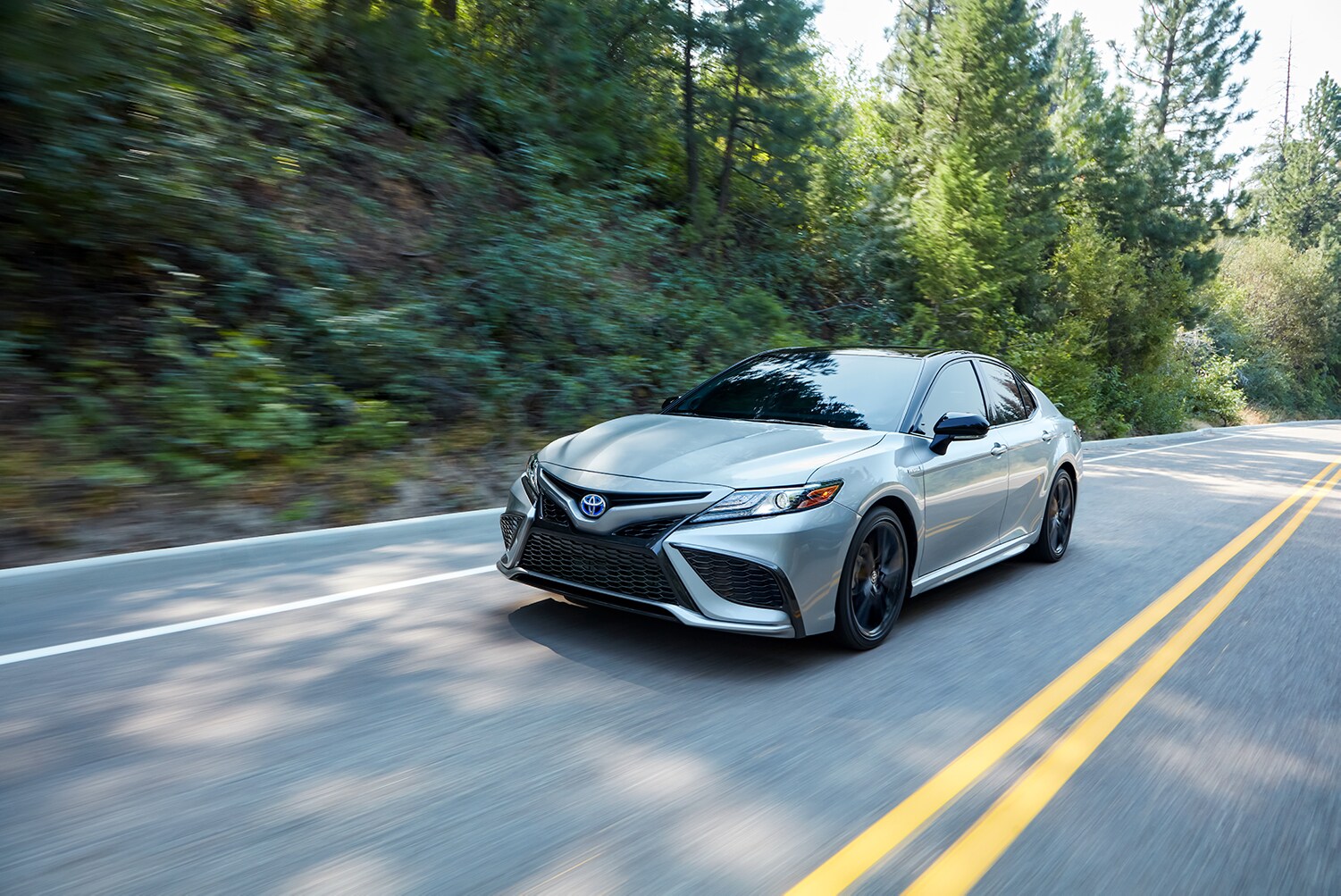 Toyota Hybrid for Everyone at Bobby Rahal Toyota | 2022 Toyota Camry Hybrid driving on road