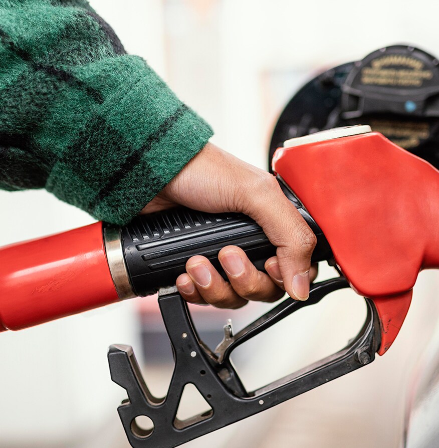 What Type of Gas is Best for My Car? | Bobby Rahal Toyota in Mechanicsburg, PA | Hand on red gas nozzle up close