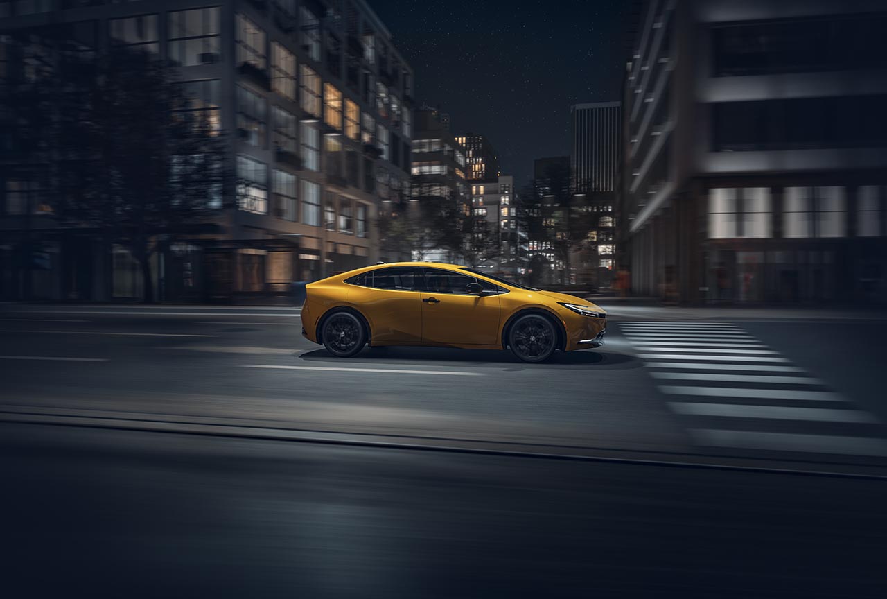2025 Toyota Prius at Bobby Rahal Toyota in Mechanicsburg, PA | Yellow 2025 Prius driving at night