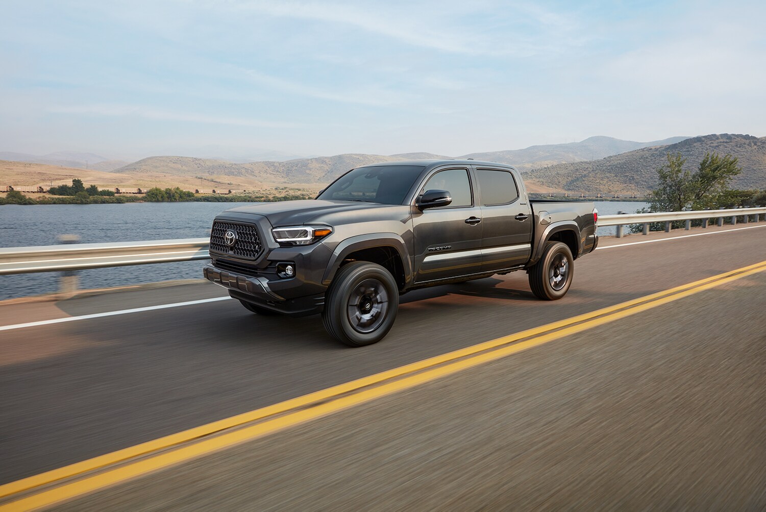 Bobby Rahal Toyota is a Car Dealership near Enola PA | The 2021 Toyota Tacoma driving on a bridge