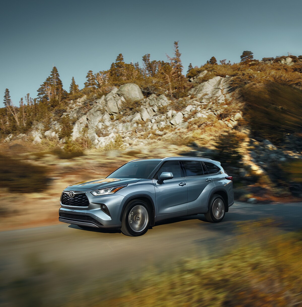 Comparison of the 2020 Toyota Highlander and the 2020 Subaru Ascent at Bobby Rahal Toyota of Mechanicsburg | 2020 Toyota Highlander zooming past