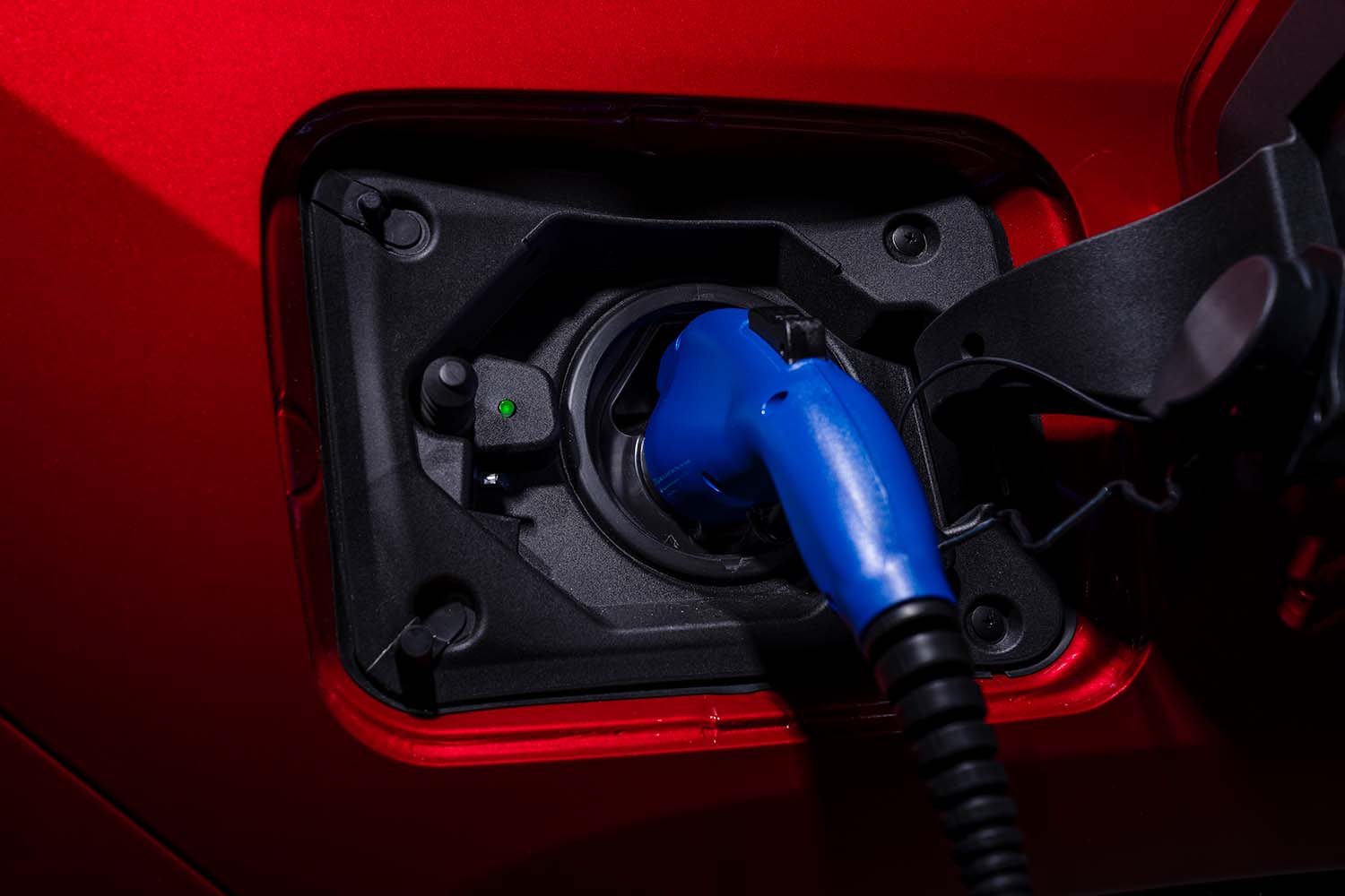 How to prepare your home for your new Plug-in Hybrid Vehicle at Bobby Rahal Toyota in Mechanicsburg, PA | Close up view of 2021 Toyota RAV4 Prime charging