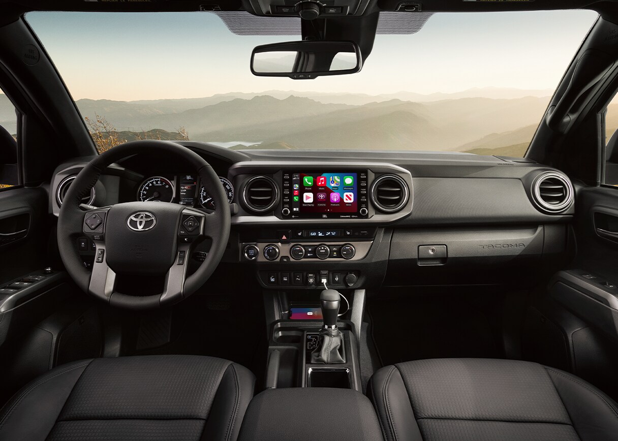Android Auto vs. Apple CarPlay at Bobby Rahal Toyota in Mechanicsburg, PA | Black Interior of Toyota Tacoma with Apple Carplay in the center