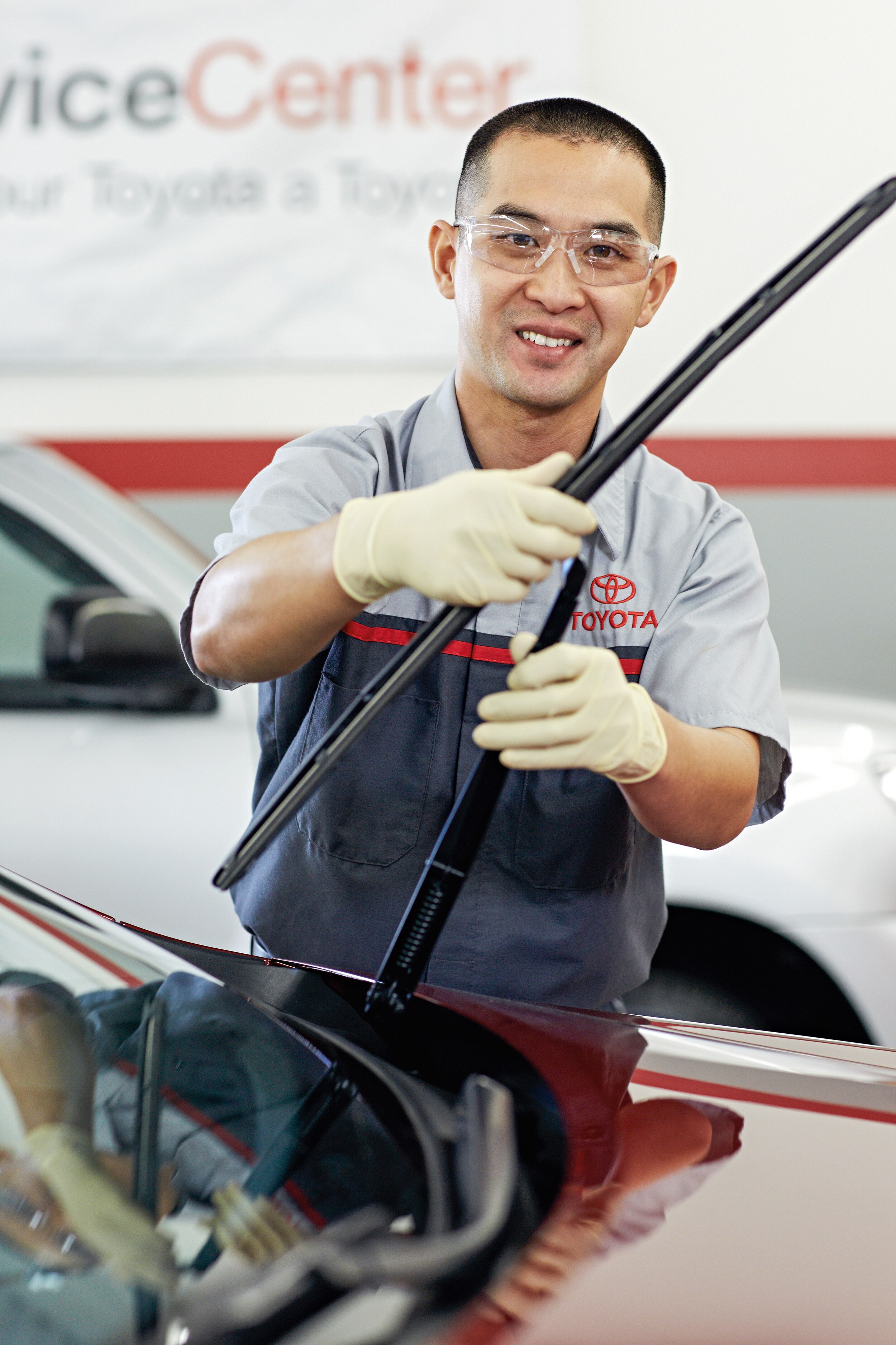 Bobby Rahal Toyota is a Car Dealership near Dillsburg PA | Toyota mechanic working on vehicle on lift
