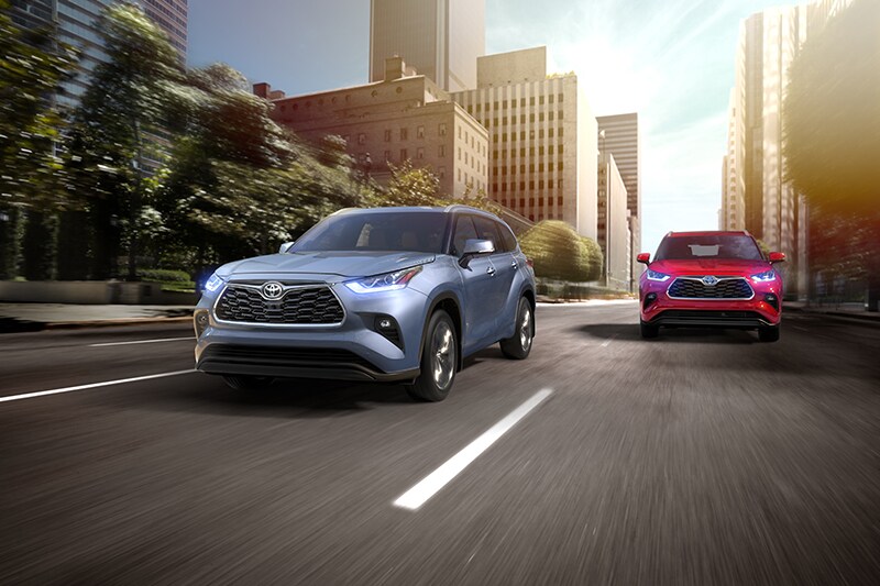 Comparison of the 2020 Toyota Highlander and the 2020 Subaru Ascent at Bobby Rahal Toyota of Mechanicsburg | two 2020 Toyota Highlanders on street