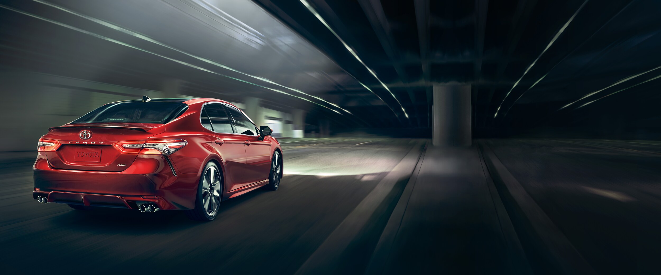 Red 2018 Toyota Camry night driving