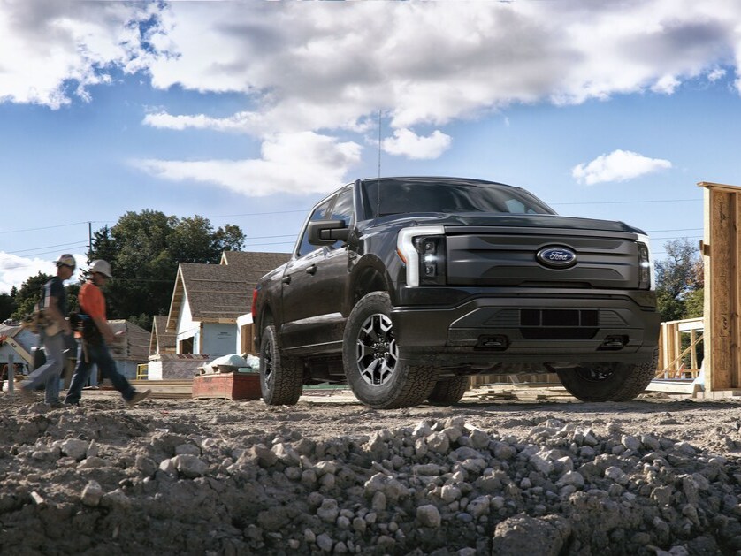 Black Ford Lightning parked at a construction site