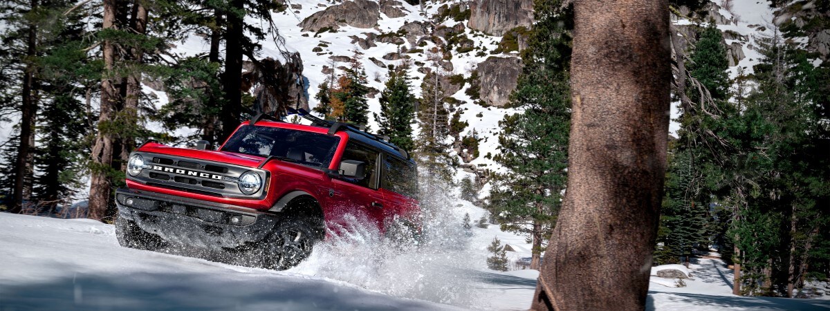 2023 Ford Bronco Red 2023 Ford Bronco in snowy mountain terrain