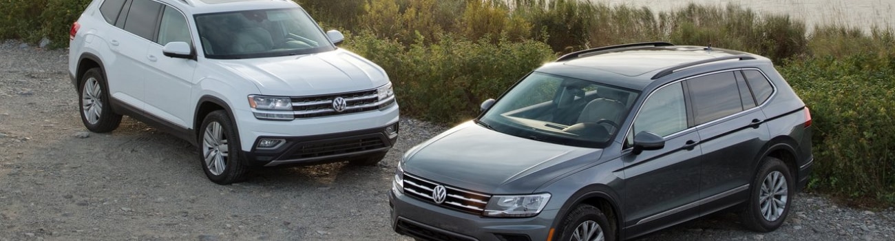 2018 Volkswagen Tiguan used SUVs Bob Penkhus Dealerships Colorado Springs.png Aerial top down look at a two 2018 Volkswagen Tiguan used SUVs parked by a small body of water off the road