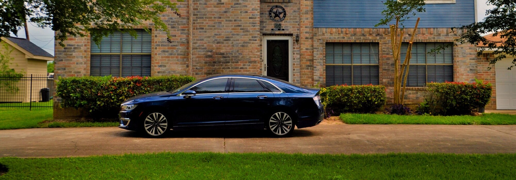 Most Cost Effective Used Cars 2020.png used dark blue luxury car parked in front of a brick modern home