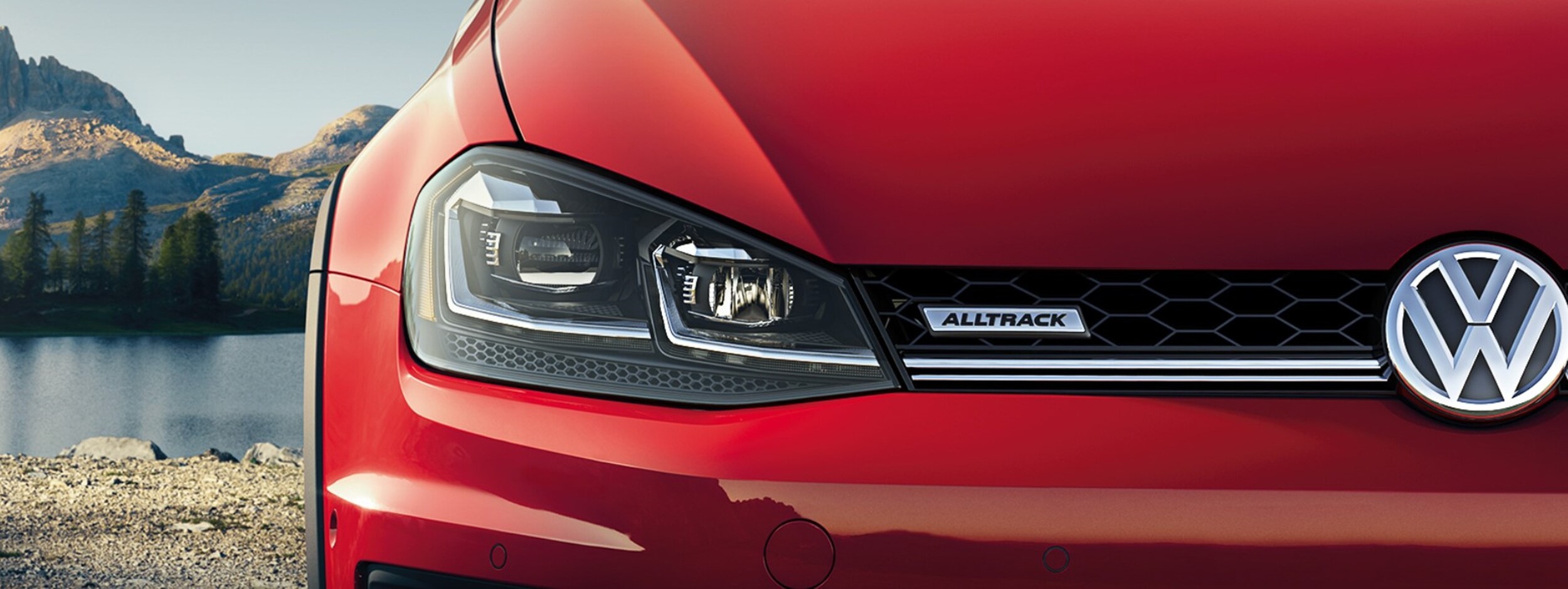 01-2019-vw-golf-alltrack-bob-penkhus-volkswagen-dealership-colorado-springs-co-exterior.jpg A closeup front view of a tomato red 2019 VW Golf Alltrack