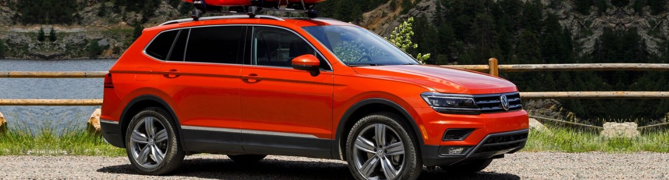 2019 Volkswagen Tiguan configurations Bob Penkhus VW Colorado Springs.png Front passenger side exterior of an orange 2019 Volkswagen Tiguan with 2 kayaks strapped to the top