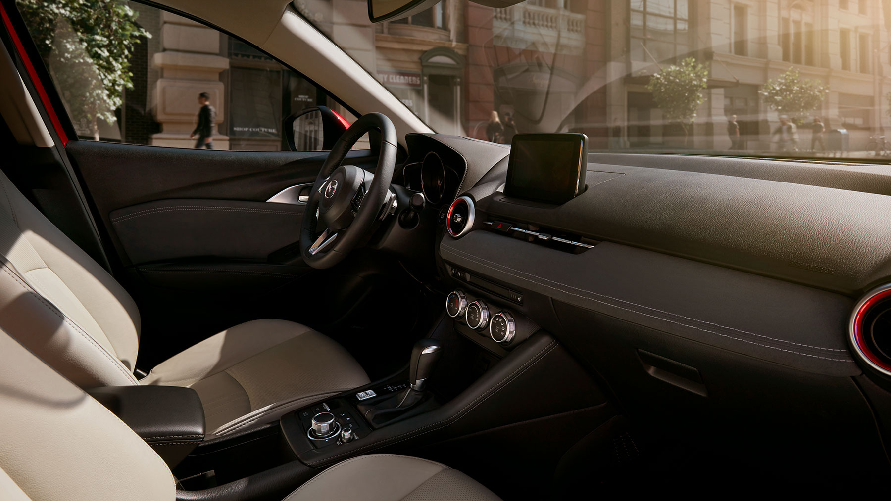 2020-mazda-cx-3-compact-crossover-bob-penkhus-mazda-dealership-colorado-springs.jpg tan and black interior seating of a 2020 Mazda CX-3