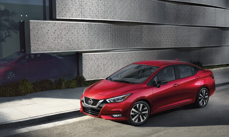 2020 Nissan Versa in red parked on street.jpg