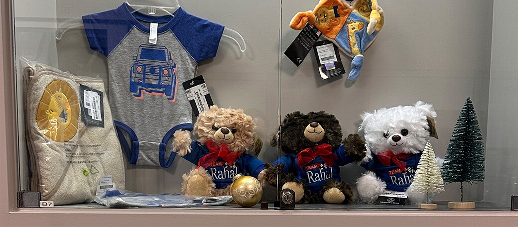 Rahal teddy bears and baby items in boutique case