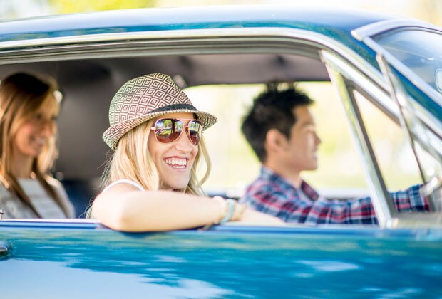 College student driving a new car