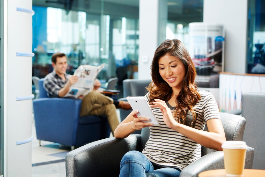 Boch Honda is a Car Dealership near Medfield, MA | Woman sitting in Honda dealership waiting for service
