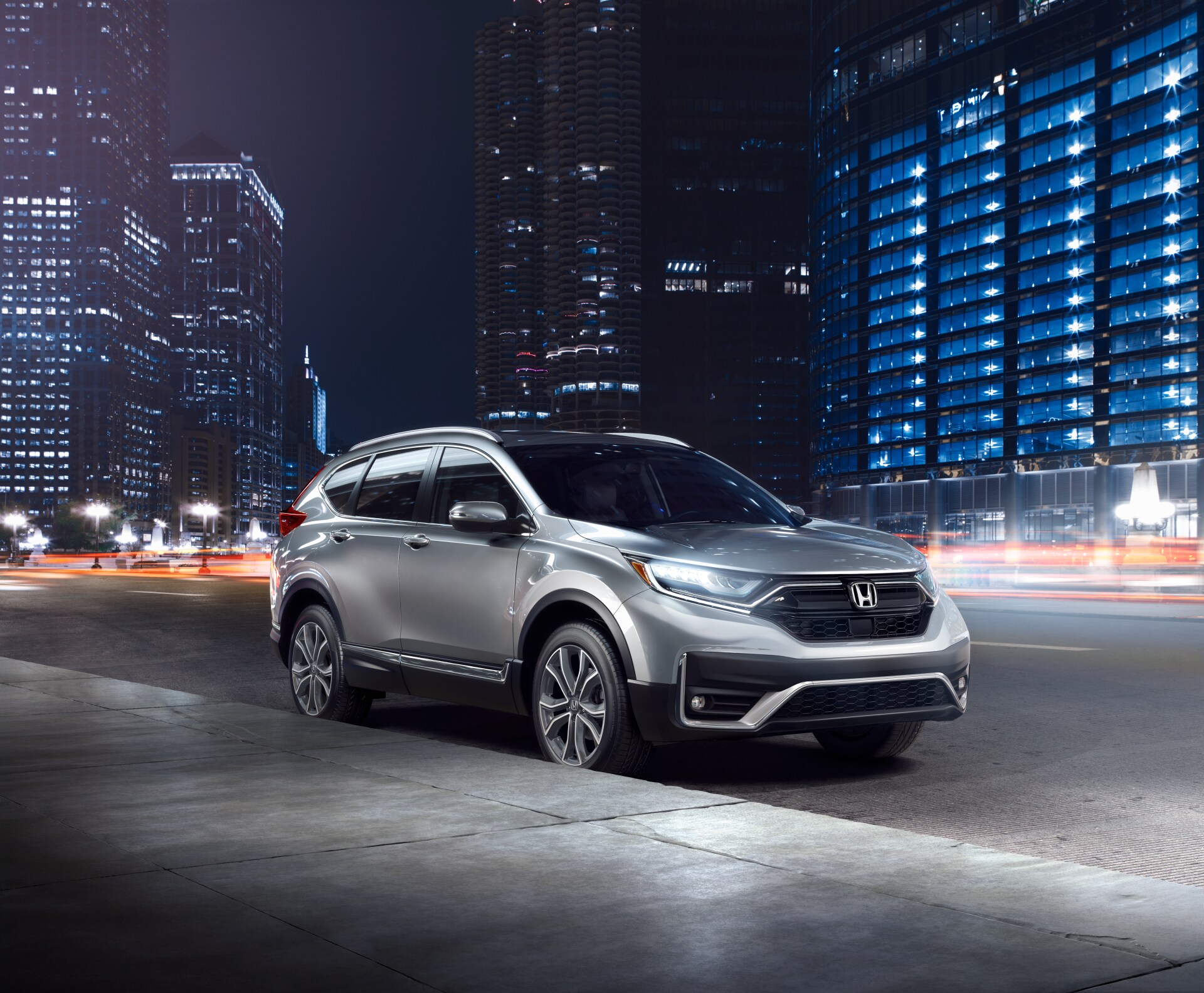 Boch Honda is a Car Dealership near Medfield, MA | Red 2020 Honda CR-V parked on city street at night