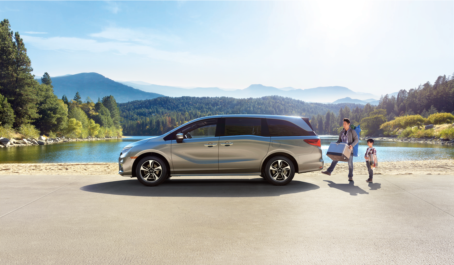 Boch Honda West is a Family Owned Dealership near Groton, MA | Father and child with 2020 Honda Odyssey by lake