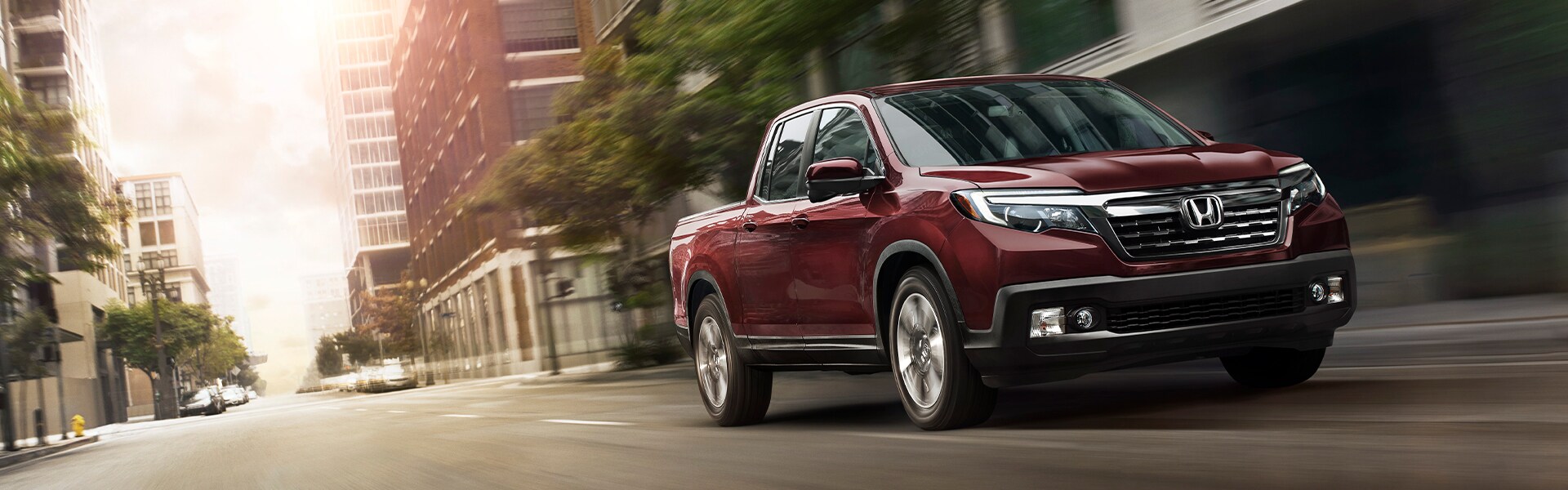 Boch Honda West is a Family Owned Dealership near Acton, MA | Red 2020 Ridgeline Driving Through City Boch Honda West is a Family Owned Dealership near Acton, MA | Red 2020 Ridgeline Driving Through City