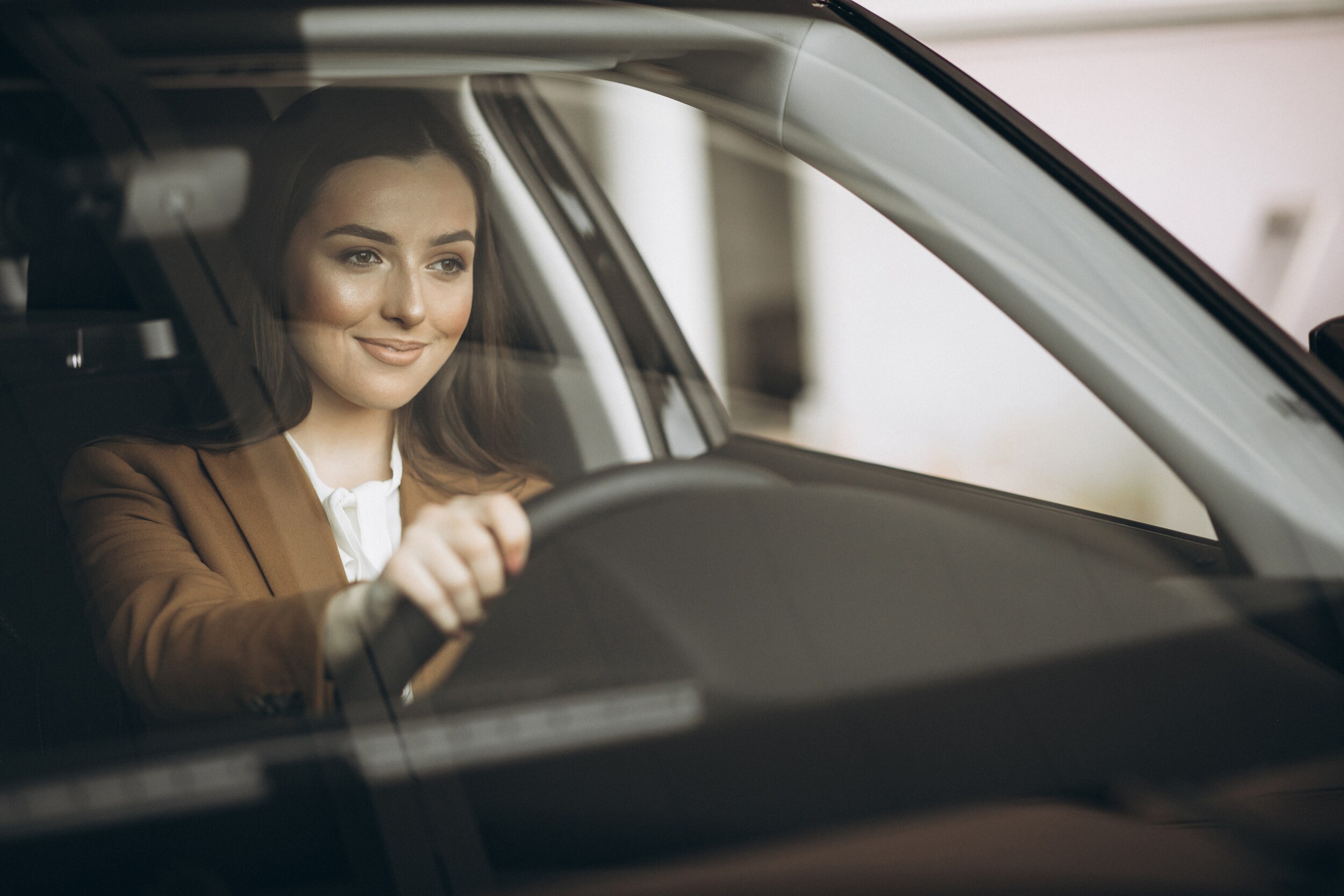Boch Honda West is a Family Owned Dealership near Boxborough, MA | Satisfied customer inside of new Honda vehicle