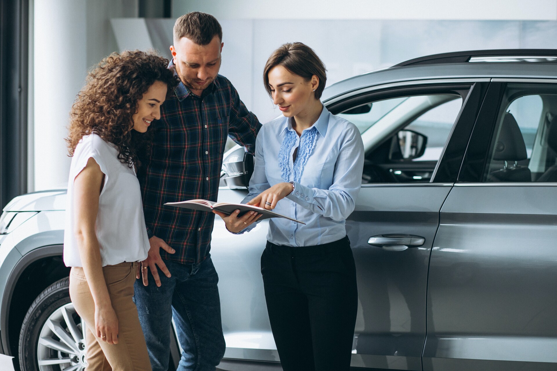 Boch Hyundai is a Luxury Car Dealership near Stoughton, MA | Couple Talking to Sales Advisor at Dealership