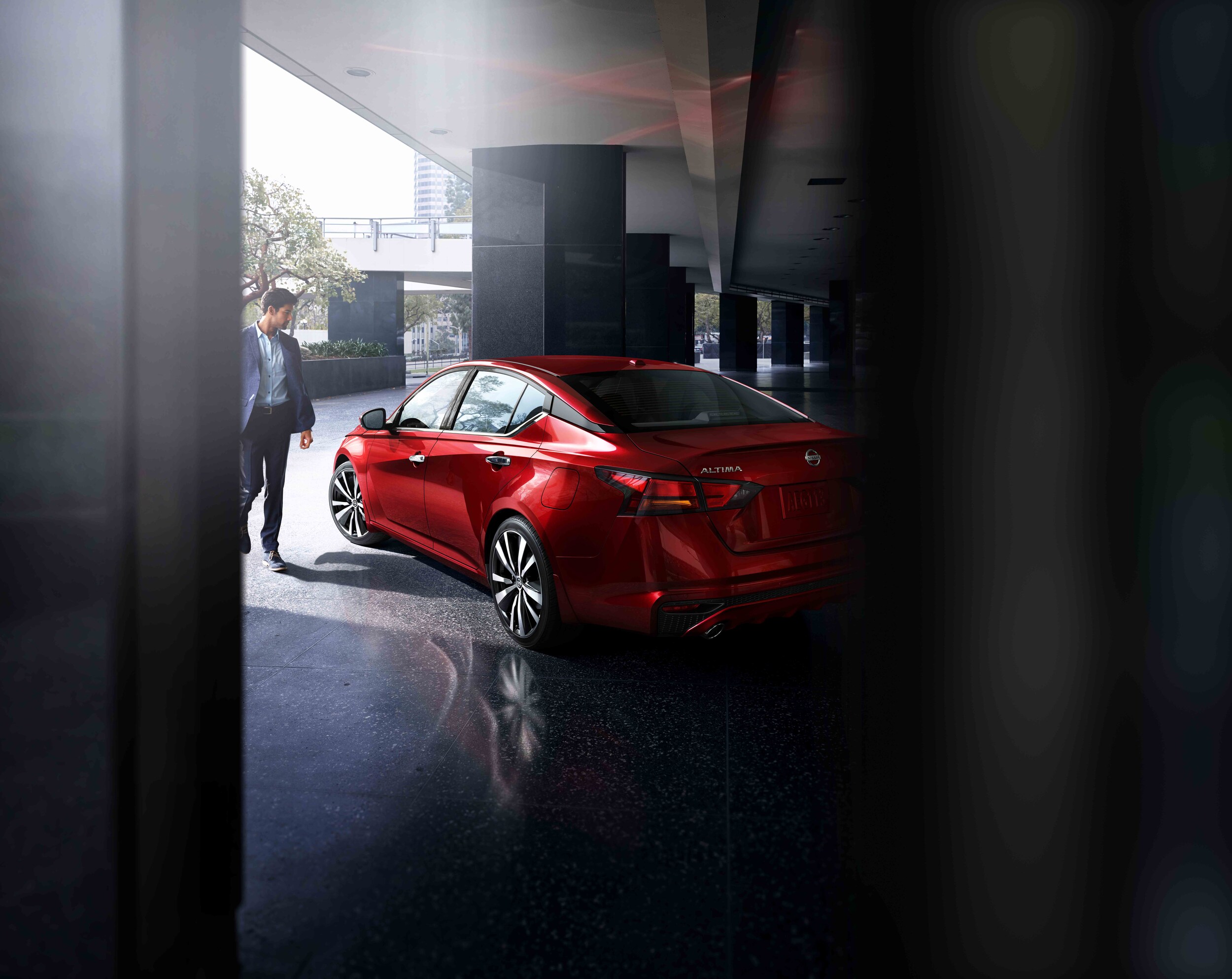 Boch Nissan is a Car Dealership near Brockton, MA | Sharp dressed man walking toward 2020 Nissan Altima