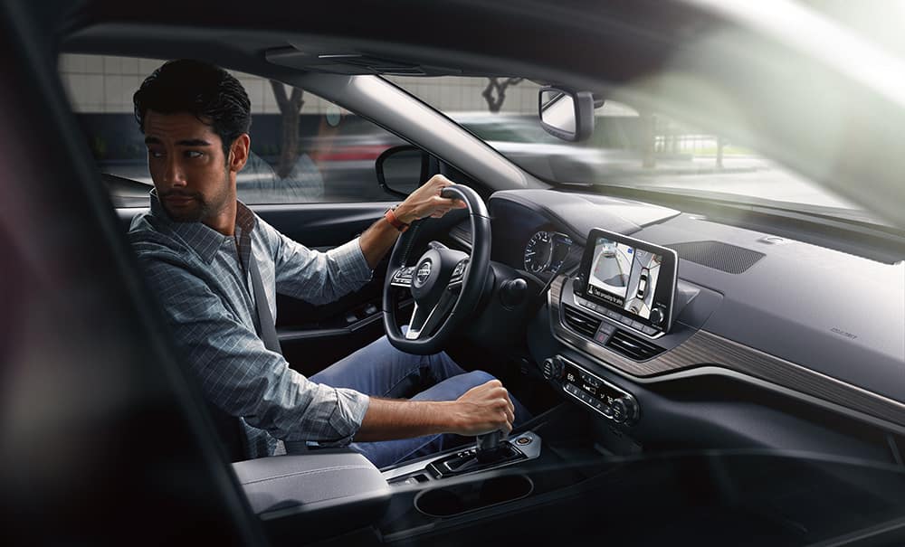 Boch Nissan South is a Family Owned Dealership near Lincoln, MA | Interior view of man driving Nissan vehicle