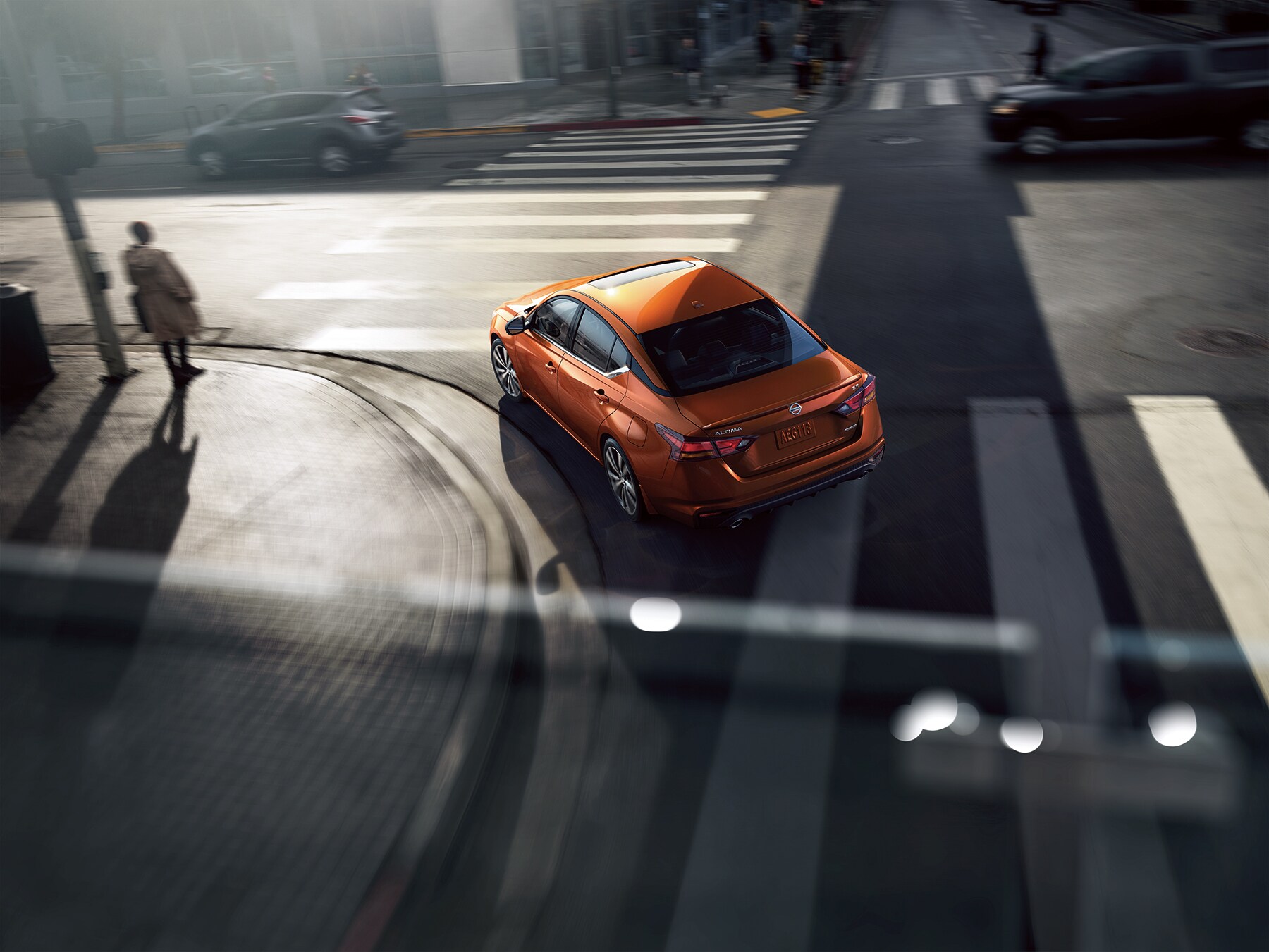 Boch Nissan South is a Family Owned Dealership near Norton, MA | 2020 Nissan Altima making a left turn on city street